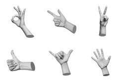 Trendy 3d collage of female hands showing gestures such as peace, thumb up, the ok, shaka, point to object, greeting isolated on white background. Contemporary art in magazine style. Modern design