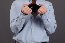 Close up Empty wallet in man's hands. no money. pay the debt. Bankruptcy concept. after black friday or tax audit