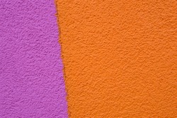purple and orange grainy background a wall of a building