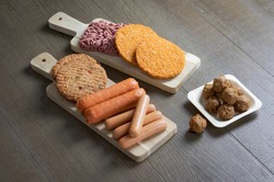 Display of plant based vegetarian meat products for a plant based diet on a wooden table