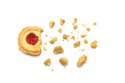 Butter cookies strawberry jam topping flavored. Some cracks and crumbs. Crunchy delicious sweet meal and useful biscuits on white background.