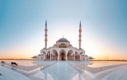 Sharjah New Mosque Famous Tourist attraction In Dubai, Arabic Letter means: Indeed, prayer has been decreed upon the believers a decree of specified times, Sharjah and Dubai Tourism concept Image