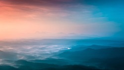 breathtaking mountains view colorful sunset with foggy weather, amazing beauty of the nature, Landscape photo taken from Kerala God's own Country, wonderful places in the world