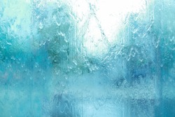 Background texture of water falling on the glass
