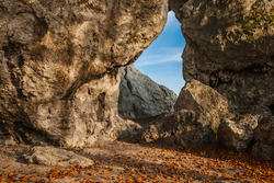 Large hole in the limestone rock (Okiennik Rzedkowicki). Beauty nature. Amazing place. Interesting tourist attraction. Upland Cracow - Czestochowa, Silesia. Rzedkowice, Poland.