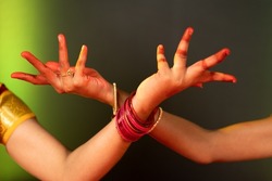 close up shot bharatanatyam dancer hands showing Avahittha hasta form or hand gesture - concept of classical dance, traditional art and bharatanatyam mudra.