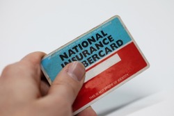 A blank Department of work and Pensions, National Insurance Numbercard. Nice close up of the detail of the card. This is used for gaining and paying NI on your job and work. Nice depth of field on.