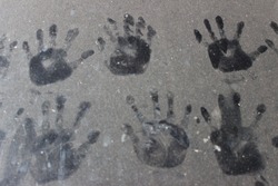 
Picture of a child's hand on the front of the car
