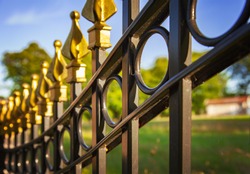 Image of a decorative cast iron fence.