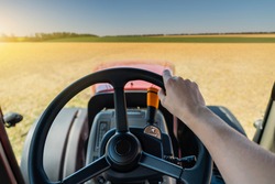 Driving a tractor. First-person view