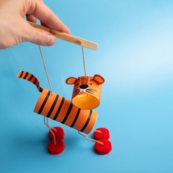 DIY toilet paper roll craft, homemade tiger toy for kids, marionette from recycled materials