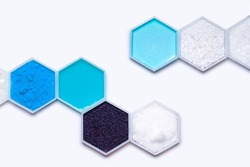 Chemical ingredient in hexagonal molecular shaped container. Sodium Thiosulfate, Copper (II) Sulfate, Shampoo, Potassium Permanganate, Sodium Hydroxide Pellets, Conditioner, Carbamide and Polyethylene