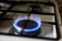 Turning on burning gas on the stove