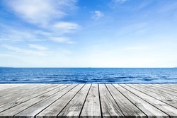 Wooden pier with blue sea and sky background