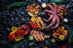 Seafood, seafood on coal, background seafood, lobster, octopus, shrimps, scampi