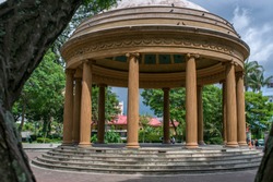 A few steps lead up to a circular pavilion in the Morazán Park, Costa Rica. It is called 