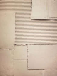 Background and Different texture of the old corrugated cardboard on the wall. Layer of brown packing and recycle paper. Scrap and patch of corrugated paperboard with copy space