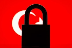 Flag of Turkey with black lock in the foreground. Closed country, international isolation concept