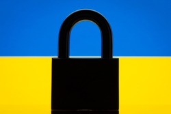 Flag of Ukraine with black lock in the foreground. Closed country, restrictions concept