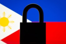 Flag of Philippines with black lock in the foreground. Closed country, international isolation concept