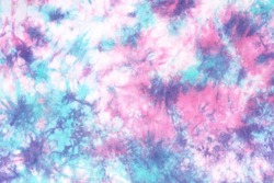 tie dye pattern hand dyed on cotton fabric background.

