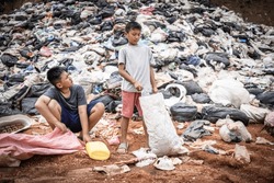 Children find junk for sale and recycle them in landfills, the lives and lifestyles of the poor, Child labor, Poverty and Environment Concepts