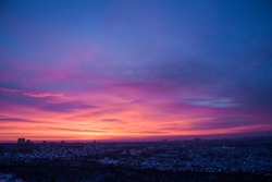 Panoramic view from the window. Dawn in the city