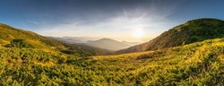 Sunrise at the top of Carpathian mountains, awesome nature landscape in the morning. Outdoor activity. Top of the mountains, lush lower parts.