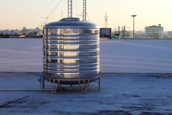 Stainless steel water tank on the roof of the building