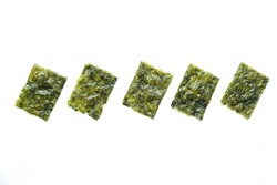 nori seaweed isolated on white background. Japanese food nori. Dry seaweed sheets. 
