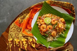 Pad thai, or Phad thai, is a stir-fried rice noodle dish from Thailand. made from rice noodles, , bean sprouts, eggs, prawns and Thai spices