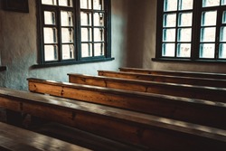 old vintage historic church school with wooden brown tables