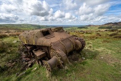 Abandoned Sherman tank in the Peak District National Park at The Roaches, Upper Hulme with Ramshaw Rocks in the distance.