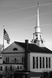A Unitarian Church and the American flag in black and white. Massachusetts, New England.