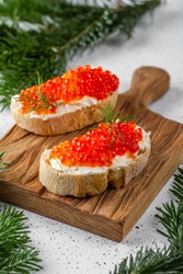 Fresh red caviar on bread. Sandwiches with red caviar.