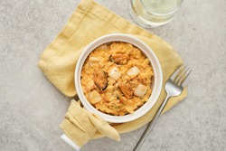Risotto with seafood on a gray background, top view