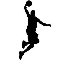 Silhouette of a basketball player jumping with a ball.