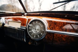 Vintage car brown marble dashboard with retro gauges.