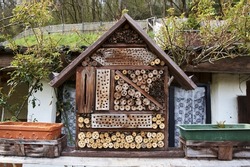 View to an insect house in the garden, protection for insects, named insect hotel, Insektenhotel.