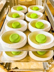 Mousse green cakes made from delicate cream mousse. small one-bite cakes are called petit fours.at catering event on some festive event,party or wedding