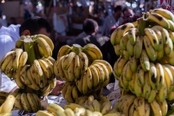 Ripe bananas at the city market. Arabic fruit and vegetable market. Tourist attractions in Egypt, city tour.