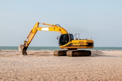 Backhoe at the beach