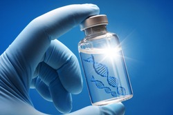 Doctor or scientist shows a vial of genetic agent as a vaccine or therapy against Corona or Covid-19 as a symbolic image