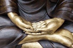 Closed up Hand of Buddha Image.