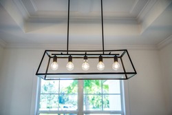 Hanging retro black metal iron chandelier lighting fixture with vintage bulbs 