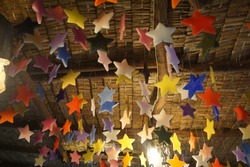 colorful star candles are hanging.