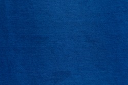 Dark Blue denim fabric texture background, the strong cotton cloth used especially to make jeans.