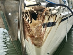 Hit boat damaged bow sitting in Phuket boat Lagoon wait for repair