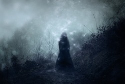 A ghostly blurred woman in a dress standing floating on a country path. With a grunge, vintage textured edit.                