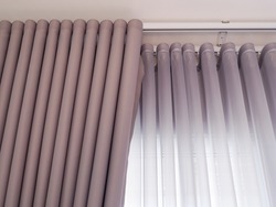 fabric curtain and white sheer curtains with translucent fabric hanging on door